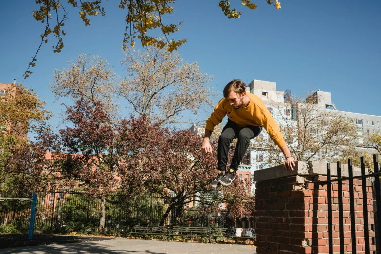 a man flying through the air while riding a skateboard, by Nina Hamnett, unsplash, happening, parkour, during autumn, humans of new york, 15081959 21121991 01012000 4k