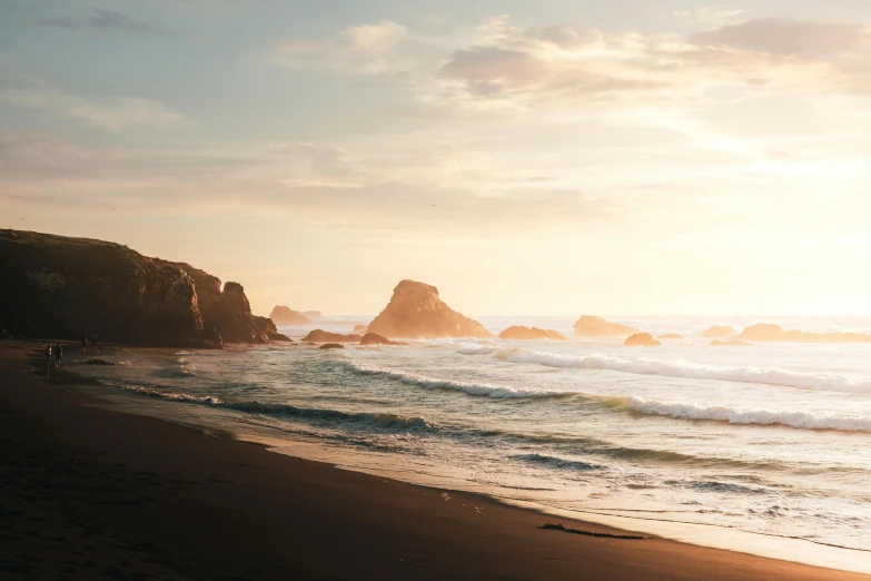 a man standing on top of a beach next to the ocean, pexels contest winner, golden bay new zealand, golden hour hues, oregon, youtube thumbnail