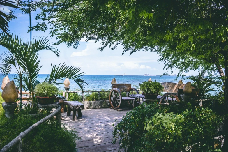 a patio with a view of the ocean, pexels contest winner, lush greenery, manila, pirate setting, subtle detailing