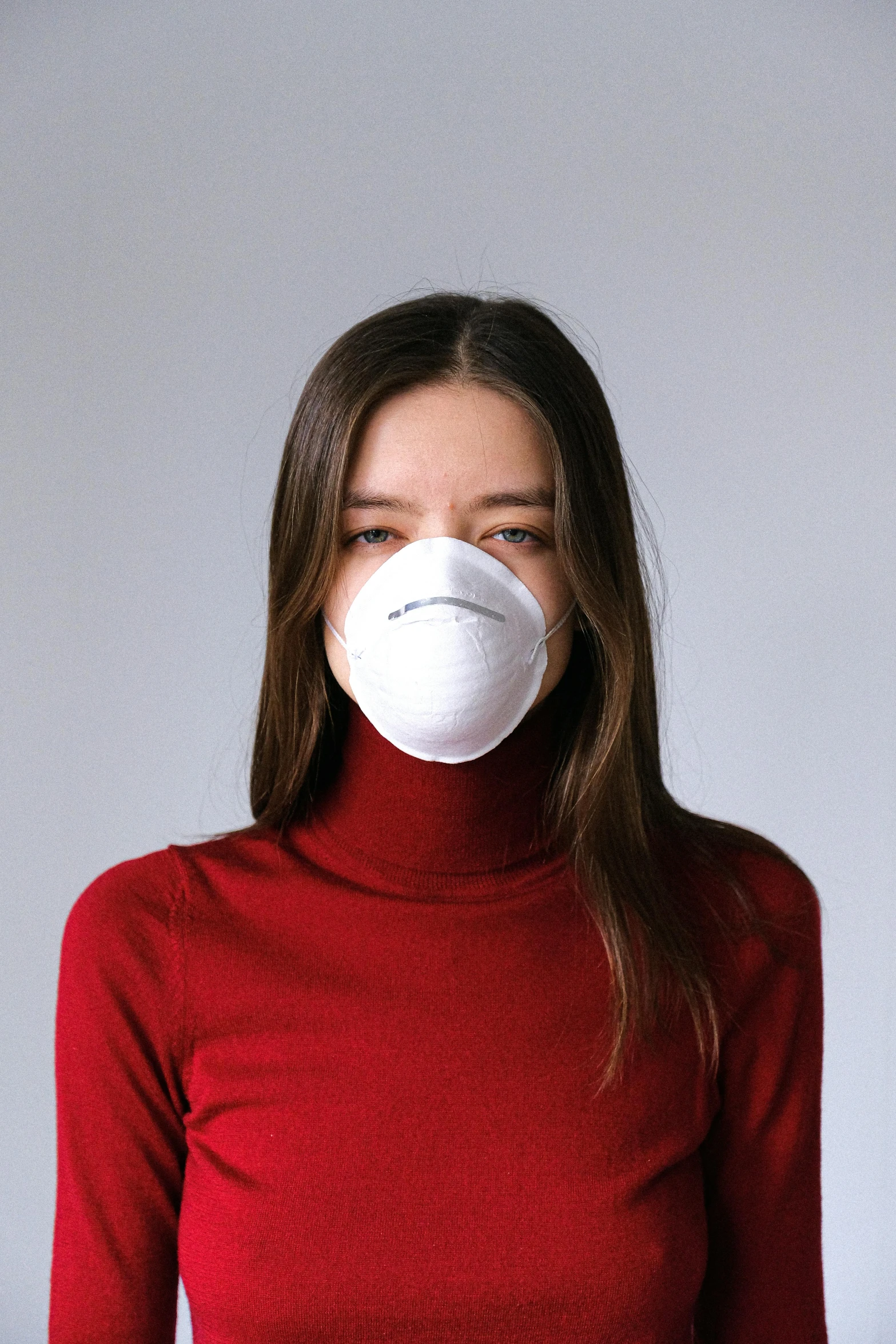 a woman in a red shirt and a white mask, in white turtleneck shirt, official product image, pollution, i és complex