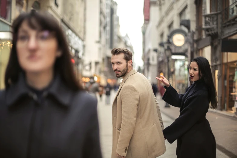 a man and a woman walking down a city street, pexels contest winner, renaissance, awkward situation, people panic in the foreground, spying discretly, promotional image
