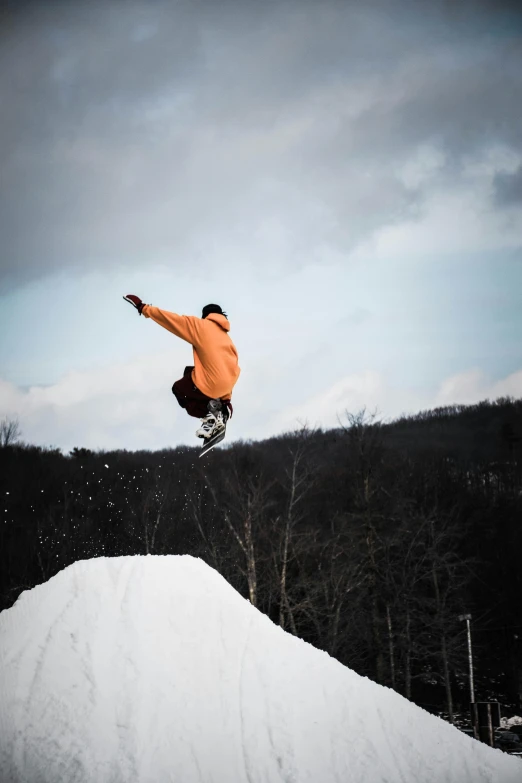 a man flying through the air while riding a snowboard, by Alison Geissler, pexels contest winner, figuration libre, new hampshire, low quality photo, gritty, instagram story