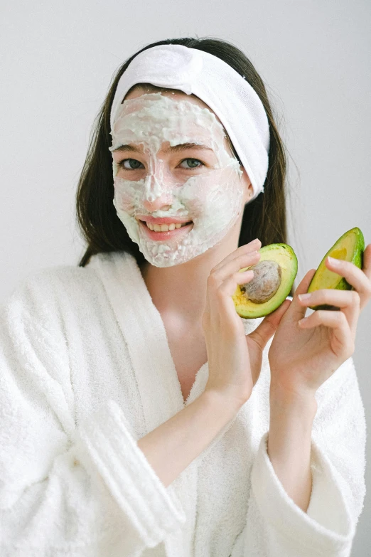 a woman in a bathrobe holding an avocado, trending on pexels, face mask, square, korean woman, banner