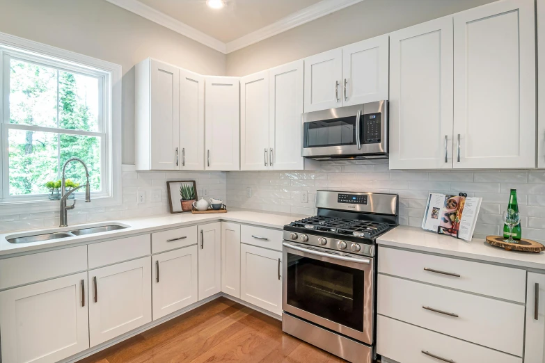 a kitchen with white cabinets and stainless steel appliances, by Carey Morris, pexels, pristine clean design, old kitchen backdrop angled view, rectangle, perfect shading