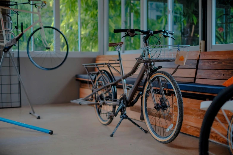 a bicycle parked next to a bench in a room, profile image, eve venture, patiphan sottiwilaiphong, engineering bay