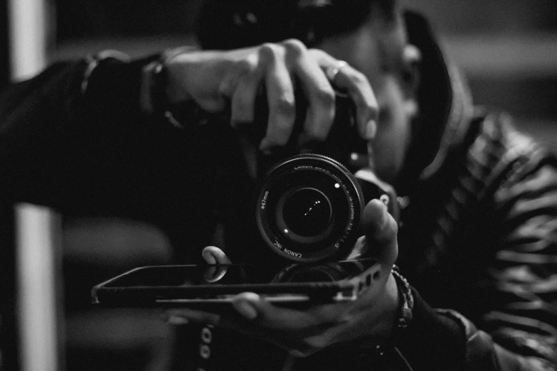 a man taking a picture with a camera, a black and white photo, by Adam Marczyński, uploaded, detailed professional photo, smartphone footage, photographs