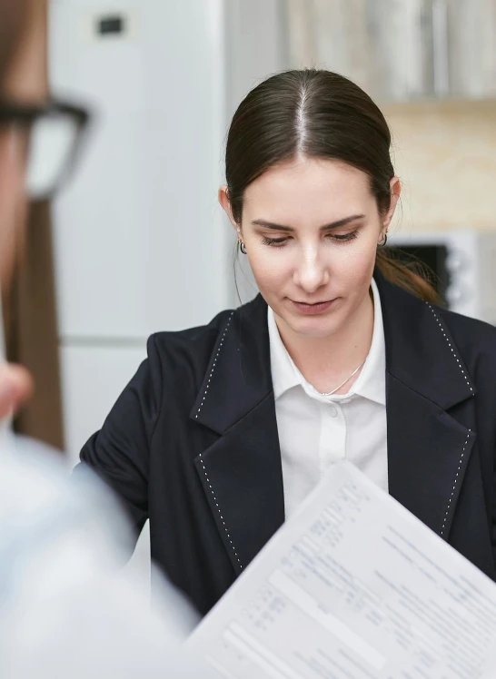 a man and a woman sitting at a table with papers, profile image, female in office dress, 2019 trending photo, thumbnail