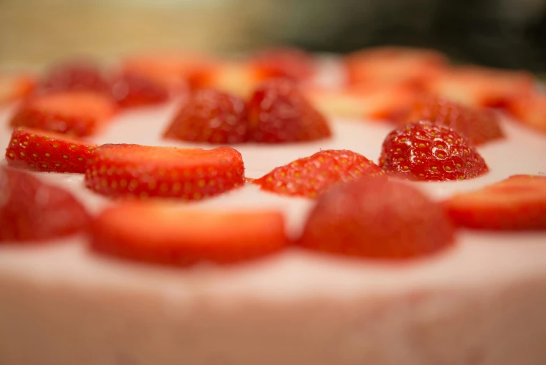 a close up of a cake with strawberries on it, by Adam Marczyński, up-close, chiffon, f / 2 0, low - angle shot