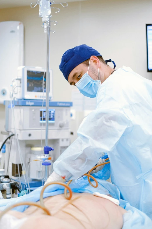 a doctor performing surgery on a patient in a hospital, instagram, happening, blue, tubes, environment, thumbnail