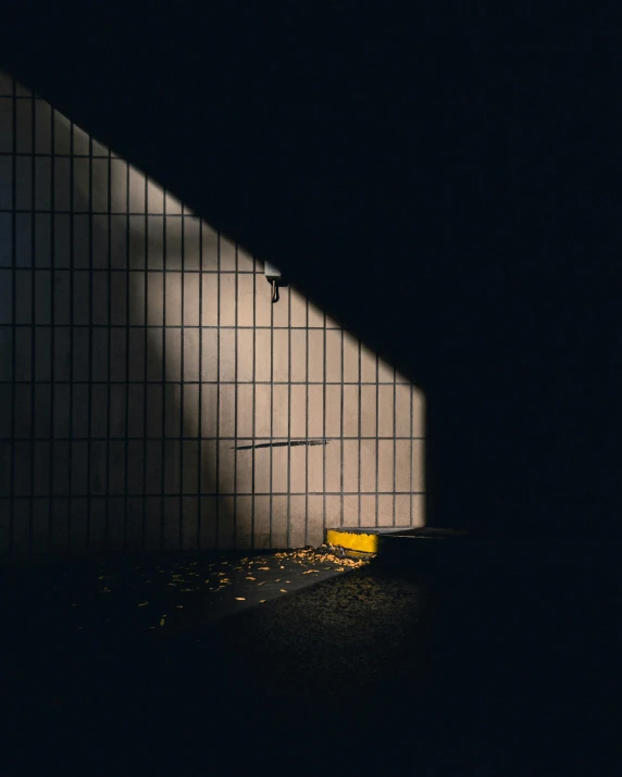 a man riding a skateboard up the side of a ramp, inspired by Elsa Bleda, unsplash contest winner, light and space, sitting in a dark prison cell, walls with tone of yellow, instagram photo, shadow polaroid photo