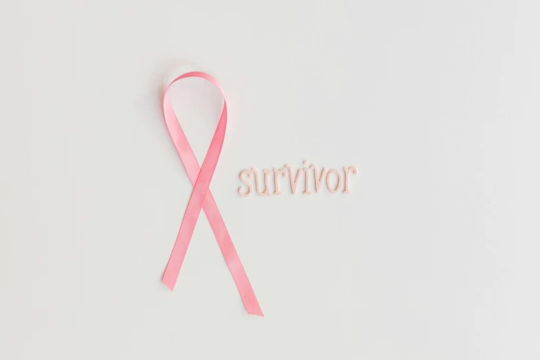 a pink ribbon with the word survivor written on it, pexels, slightly tanned, mummy, instagram post, white