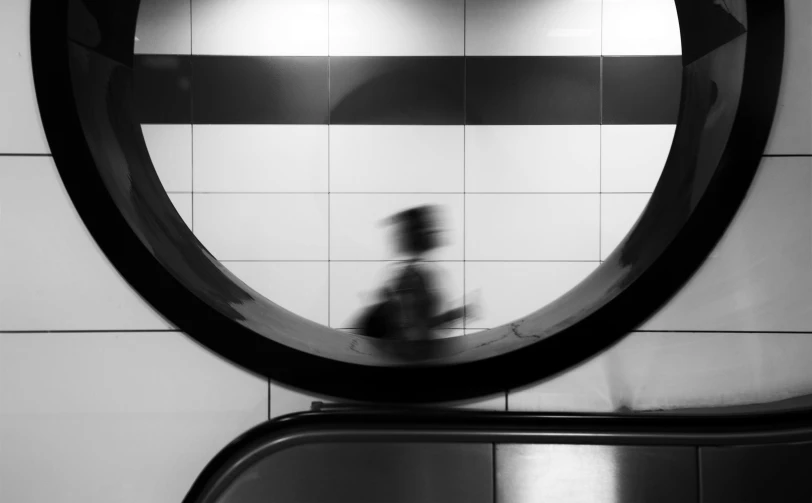 a black and white photo of a person riding an escalator, running, tubes, animation, thumbnail