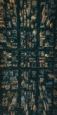 an aerial view of a city at night, an album cover, unsplash contest winner, highly symmetrical, bird\'s eye view, detailed photo 8 k, low - angle shot