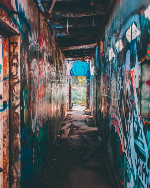 a hallway with lots of graffiti on the walls, pexels contest winner, rich decaying colors!, instagram post, background image, ruined town