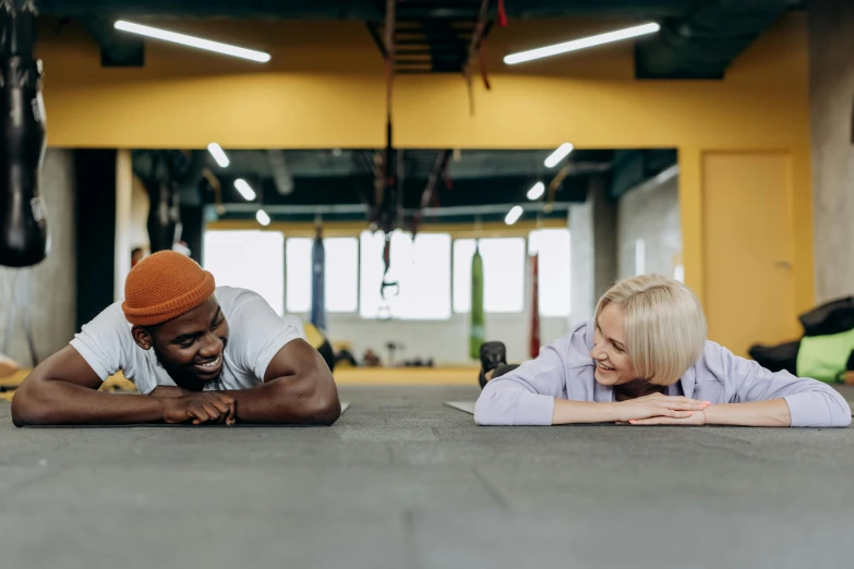 a man and woman doing push ups in a gym, by Emma Andijewska, hurufiyya, smiling at each other, bowater charlie and brom gerald, headspace, profile image