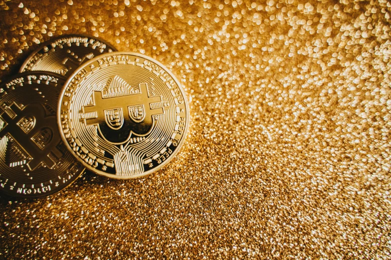 a bitcoin sitting on top of a shiny surface, by Julia Pishtar, gold eyeshadow, thumbnail, glitter background, golden eal