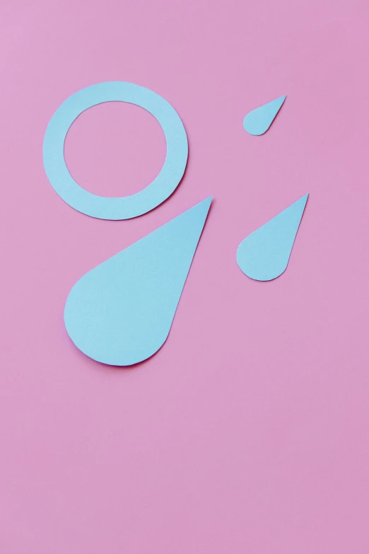 a pair of scissors sitting on top of a pink surface, filled with water, graphic shapes, tear drop, hydration