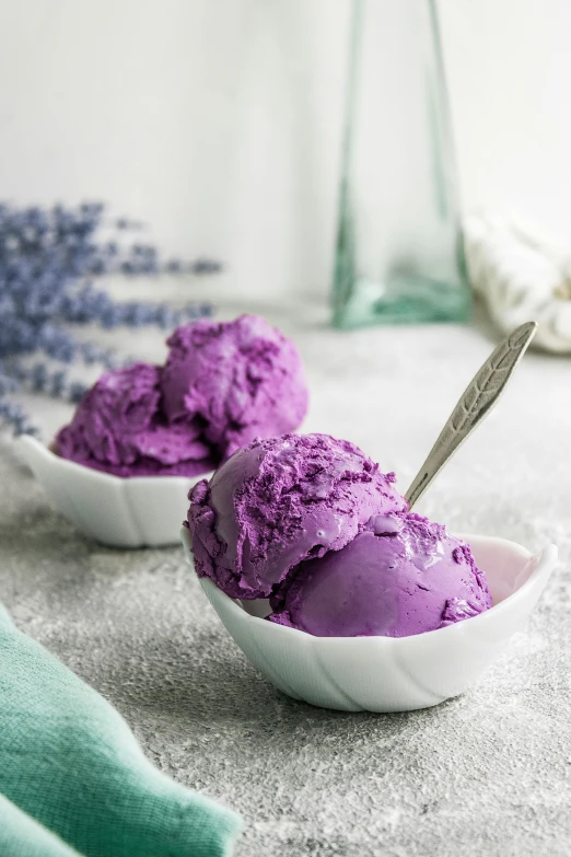 two bowls of purple ice cream with spoons, a portrait, inspired by Violet Fuller, trending on pexels, made of glazed, color”, premium, salvia