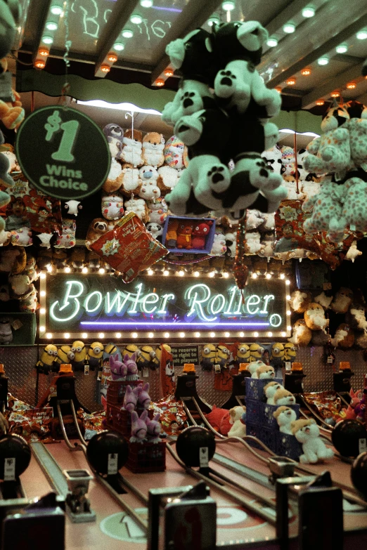 a store filled with lots of stuffed animals, an album cover, inspired by Joseph Bowler, kinetic art, roller coaster, 1987 photograph, poker, bows