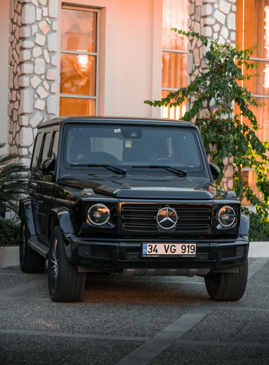 a black mercedes benz benz benz benz benz benz benz benz benz benz benz benz benz benz benz, a portrait, by Carlo Martini, unsplash, renaissance, land rover defender 110 (1985), monaco, photographed for reuters, warm glow