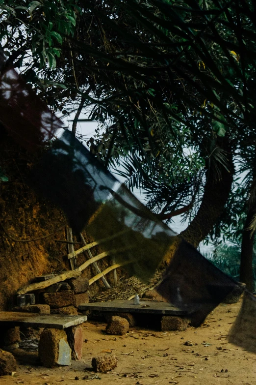 a man riding on the back of a horse down a dirt road, an album cover, by Sunil Das, unsplash, bengal school of art, in a tree house, panoramic anamorphic, medium format. soft light, reflections on a glass table