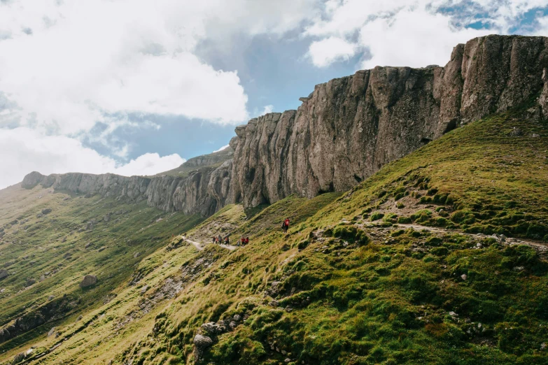 a group of people walking up the side of a mountain, les nabis, edinburgh, craggy mountains, instagram post, thumbnail