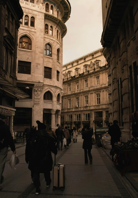 a group of people walking down a street next to tall buildings, a photo, pexels contest winner, viennese actionism, italian renaissance architecture, profile image, beige, on a great neoclassical square
