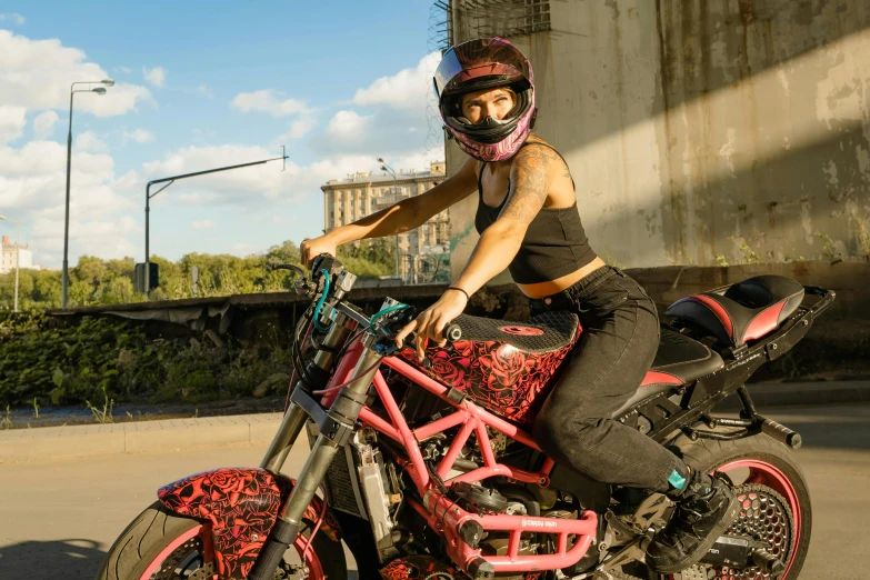 a woman riding on the back of a pink motorcycle, pexels contest winner, graffiti, avatar image, nychos, wearing urban techwear, justina blakeney