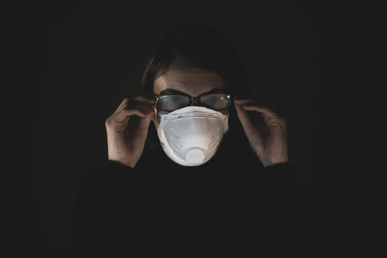 a woman wearing a face mask in the dark, pexels contest winner, wearing glack glasses, worksafe. instagram photo, pollution, a very macular woman in white