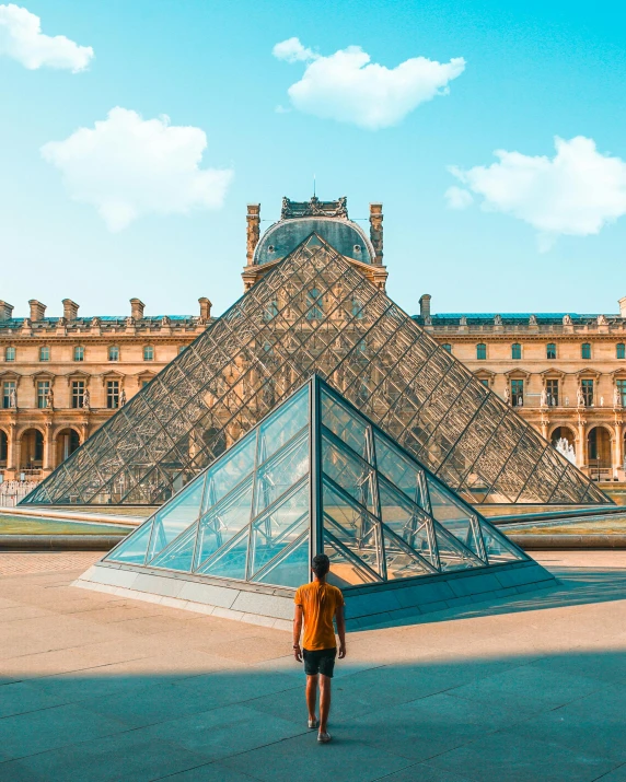 a person standing in front of a glass pyramid, pexels contest winner, visual art, french garden, lgbtq, 🚿🗝📝, a wide open courtyard in an epic