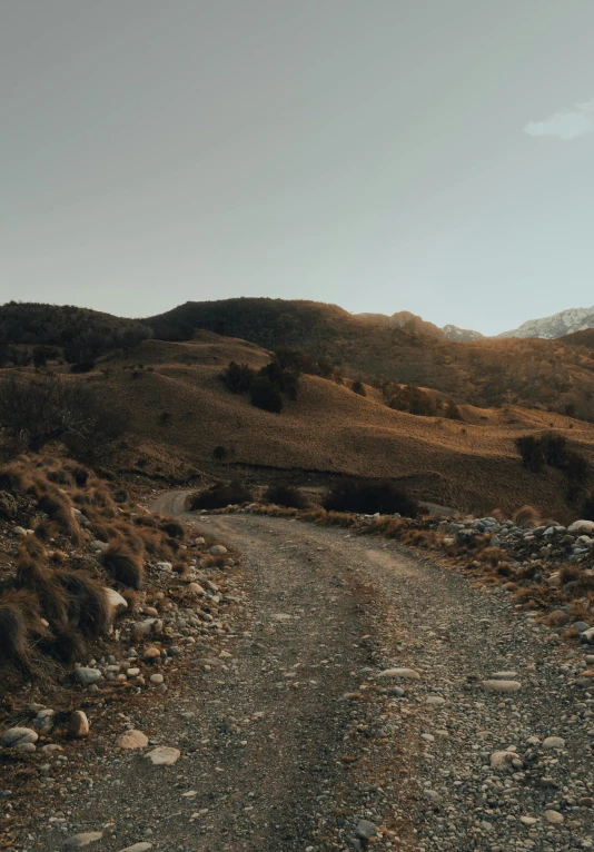 a dirt road with mountains in the background, by Alexis Grimou, les nabis, 4k movie still, vray cinematic smooth, ultra realistic 8k octan photo, **cinematic