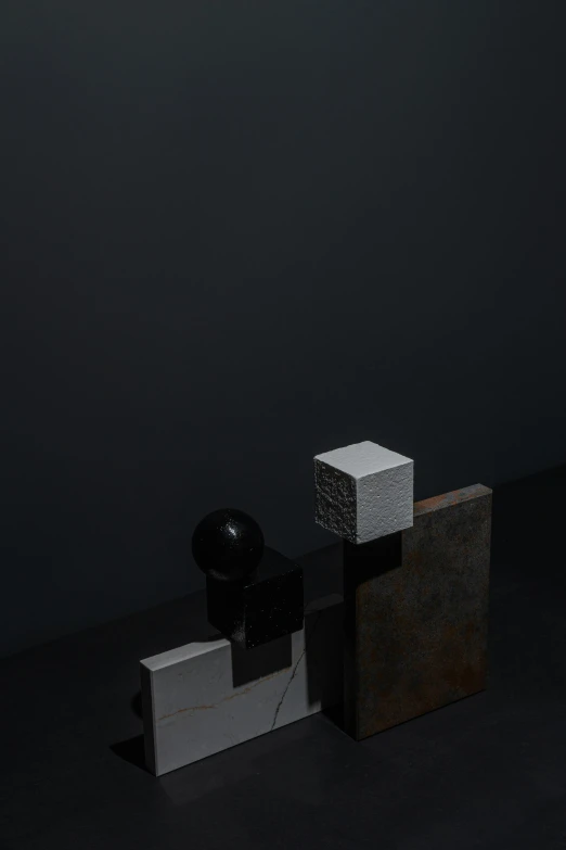 a couple of boxes sitting on top of a table, an abstract sculpture, by Harvey Quaytman, unsplash, dark figurings, ignant, blocky, with small object details