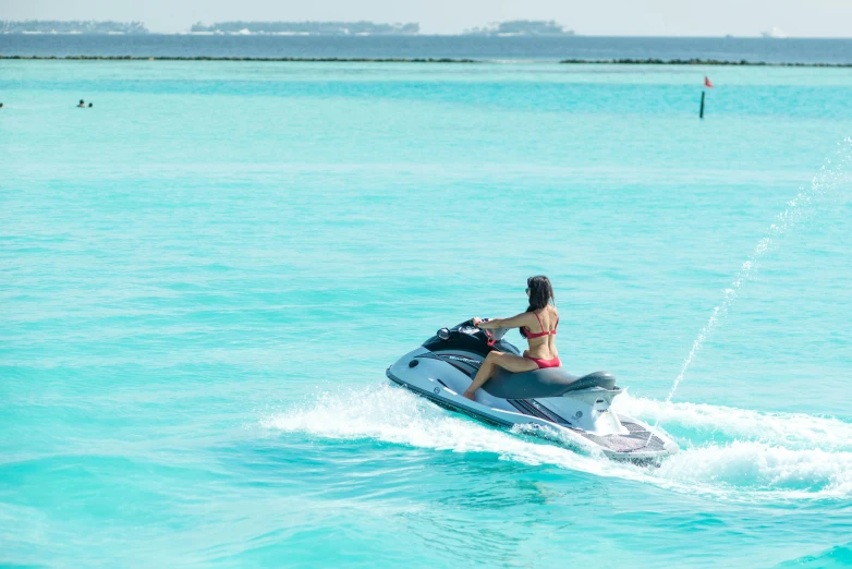 a woman riding a jet ski in the ocean, hurufiyya, turquoise water, dua lipa, al fresco, profile image