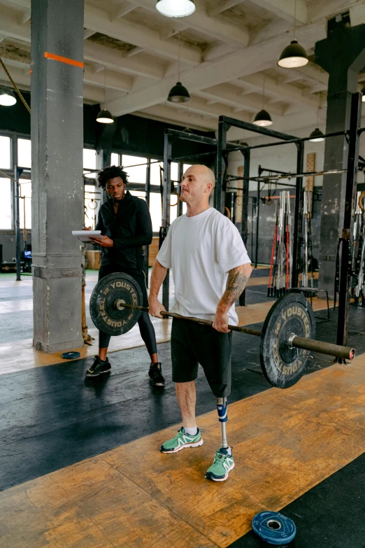 a man holding a barbell in a gym, by Adam Marczyński, renaissance, prosthetic, awarding winning, demna gvasalia, of a full body