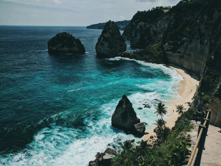 a large body of water next to a cliff, pexels contest winner, polinesian style, beach aesthetic, thumbnail, flatlay