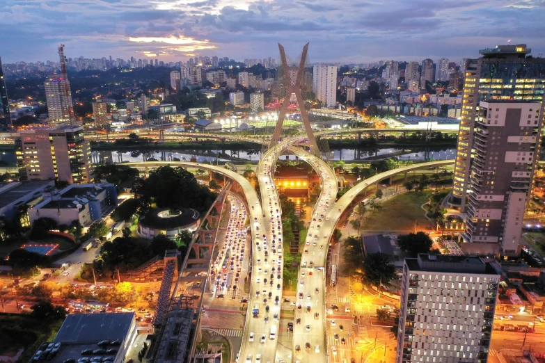 an aerial view of a city at night, by Joze Ciuha, pexels contest winner, oscar niemeyer, elegant bridges between towers, são paulo, composite