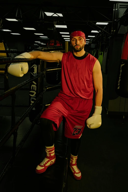 a man posing for a picture in a boxing ring, doug walker, red sport clothing, shot with sony alpha 1 camera, ethan klein