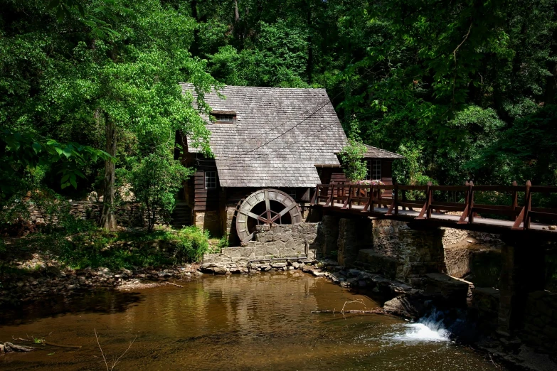 a water mill in the middle of a forest, inspired by Asher Brown Durand, pexels contest winner, renaissance, 💋 💄 👠 👗, alabama, exterior view, wheel