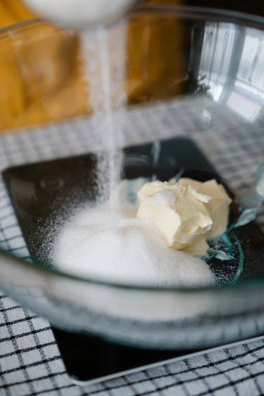 a glass bowl filled with sugar and butter, unsplash, square, baking a cake, dynamic closeup, kek