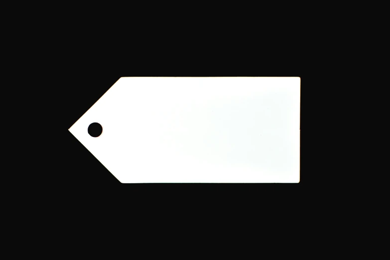 a white tag on a black background, arrow shaped, white finish, lumi, contain