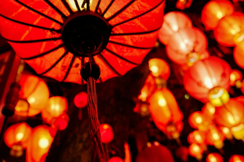 a bunch of red lanterns hanging from the ceiling, pexels contest winner, glowing red veins, fan favorite, at night, parasols