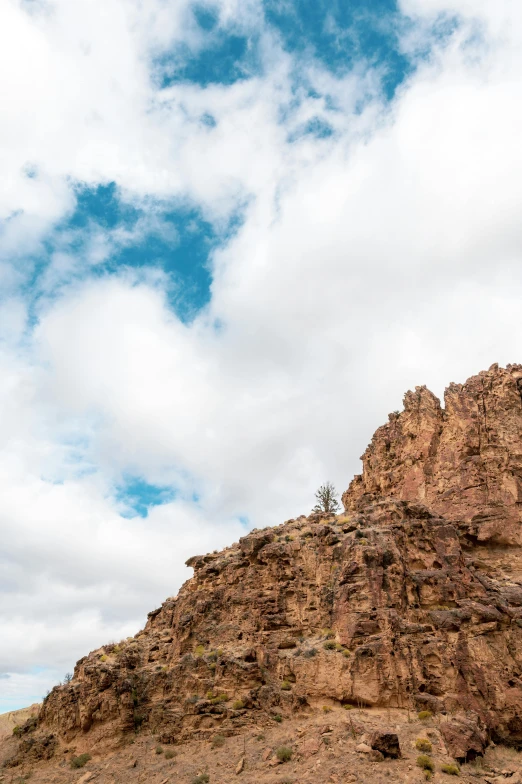 a man flying through the air while riding a snowboard, unsplash, les nabis, mogao grottoes, puffy clouds, new mexico, slide show