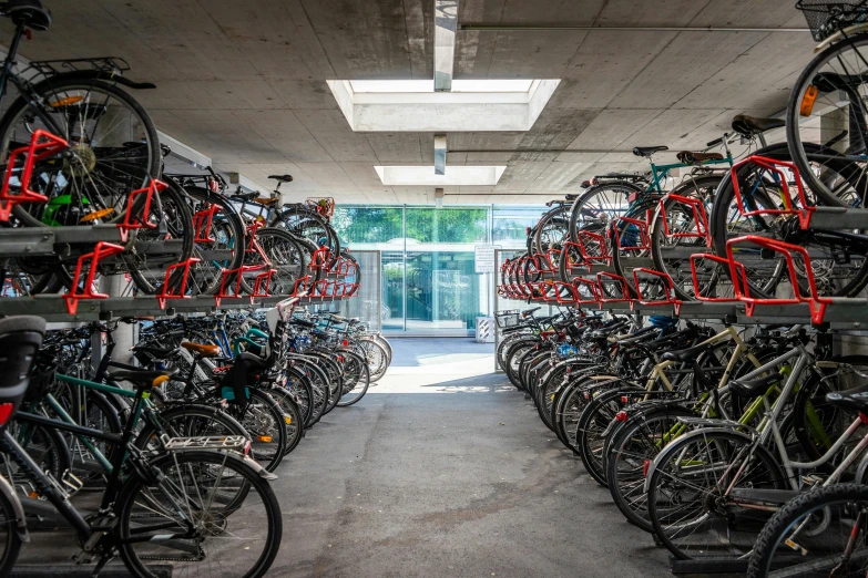 a room filled with lots of bikes next to a building, jörmungandr, profile image, splento, platforms