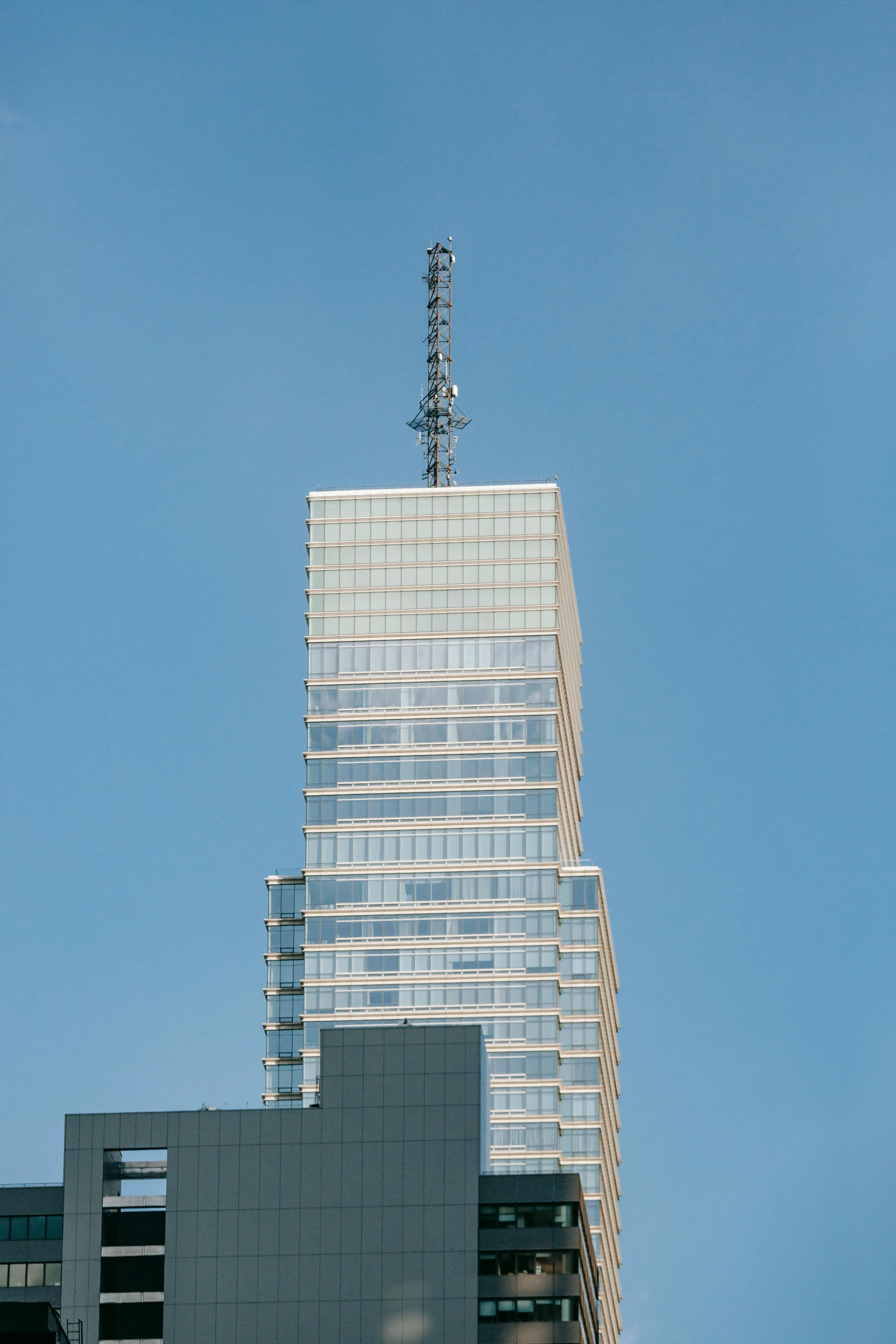 a very tall building sitting in the middle of a city, viewed from the side, gigapixel photo, square, irwin penn