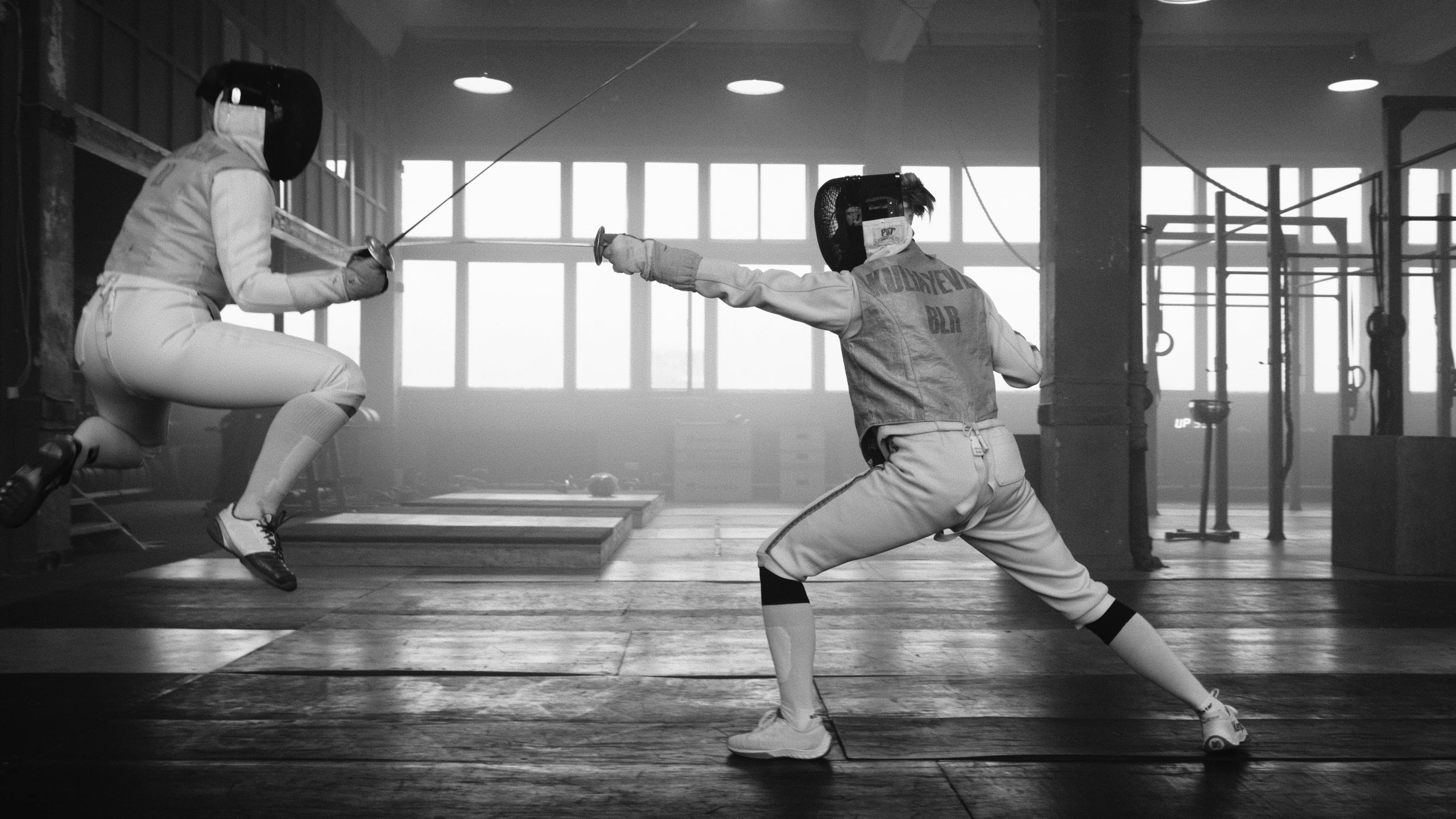 a couple of people standing on top of a wooden floor, by Juergen von Huendeberg, pexels contest winner, fine art, fencing, 1960's olympics footage, sparring, videogame still