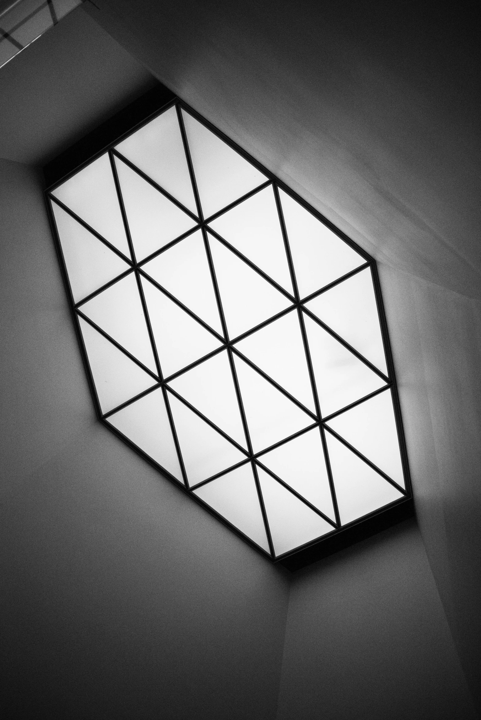 a black and white photo of a ceiling light, inspired by Alexander Rodchenko, geometric tesseract, stained glass window geometric, fluorescent ceiling lights, simple ceiling