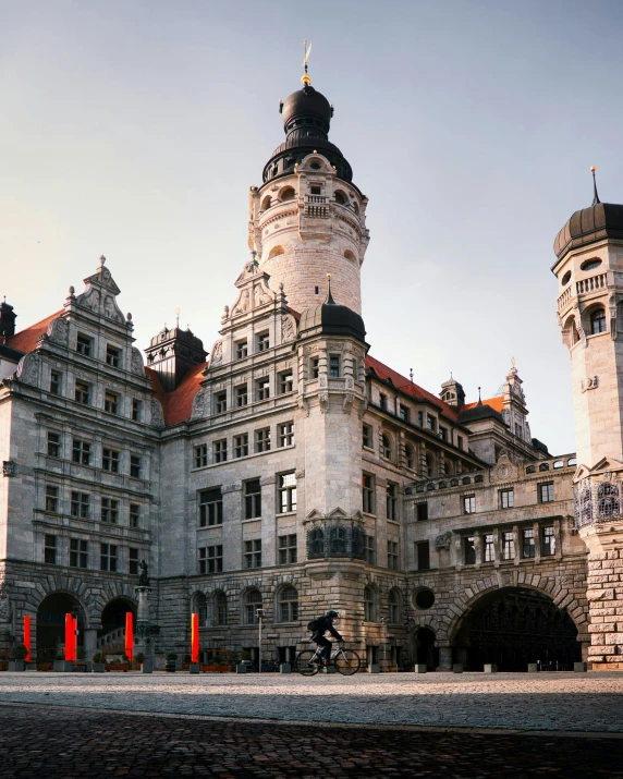 a large castle like building with a clock tower, unsplash contest winner, art nouveau, hannover, white stone arches, 8k resolution”, three towers