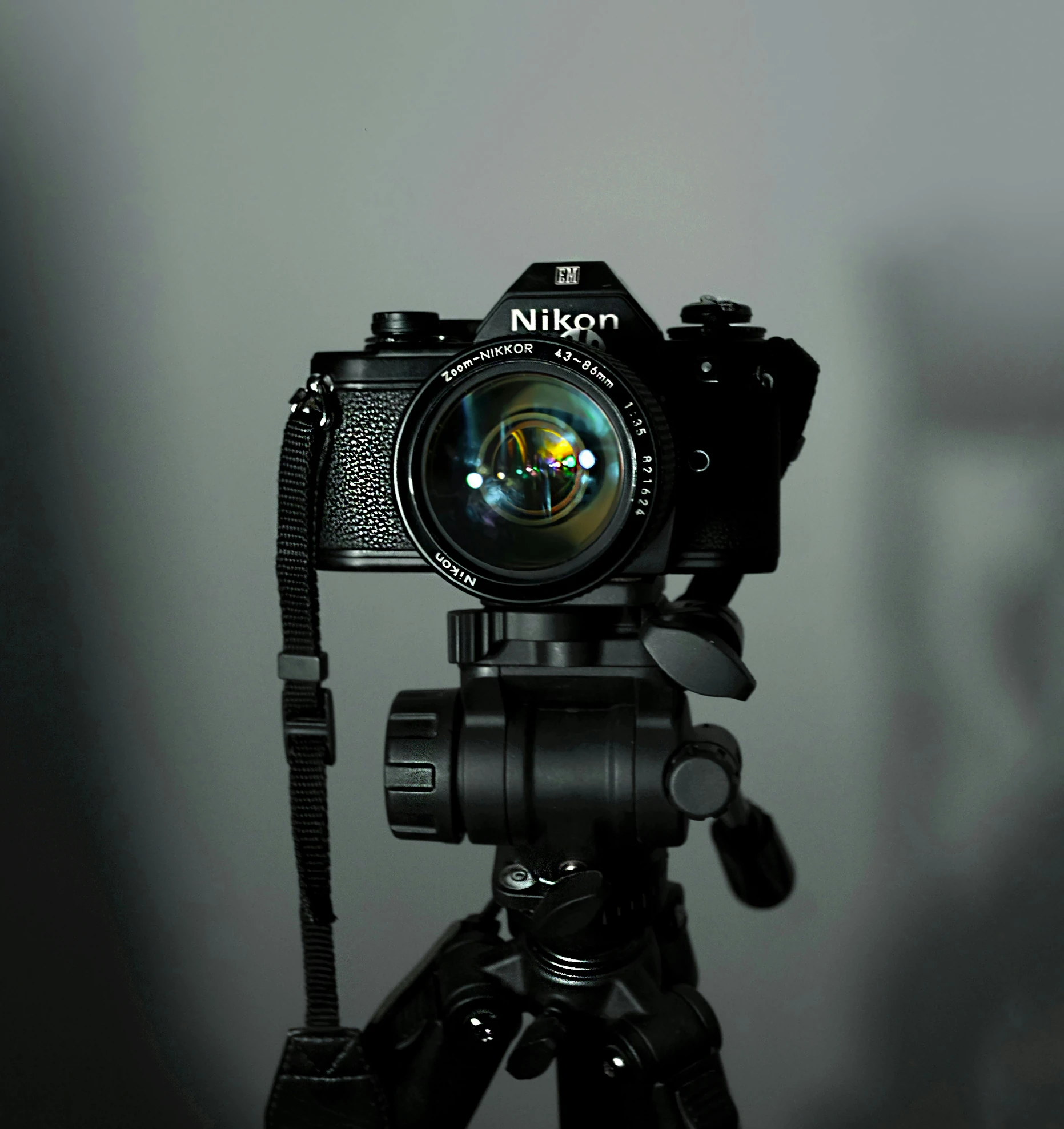 a close up of a camera on a tripod, in front of a black background, shot on nicon camera, hyperrealistic n- 4, instagram post