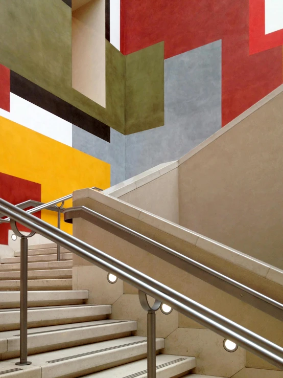 a close up of a set of stairs in a building, inspired by Bauhaus, public works mural, both bright and earth colors, architectural digest, square