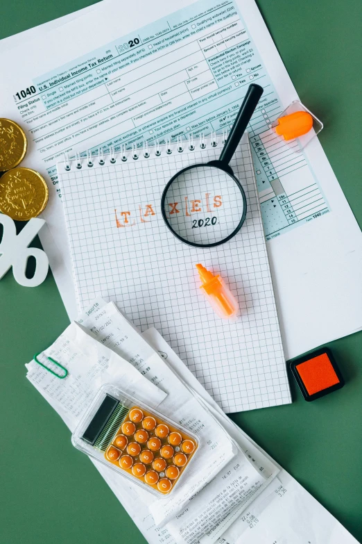 a calculator sitting on top of a table next to a calculator and a magnifying glass, analytical art, thumbnail, flat lay, 6, series